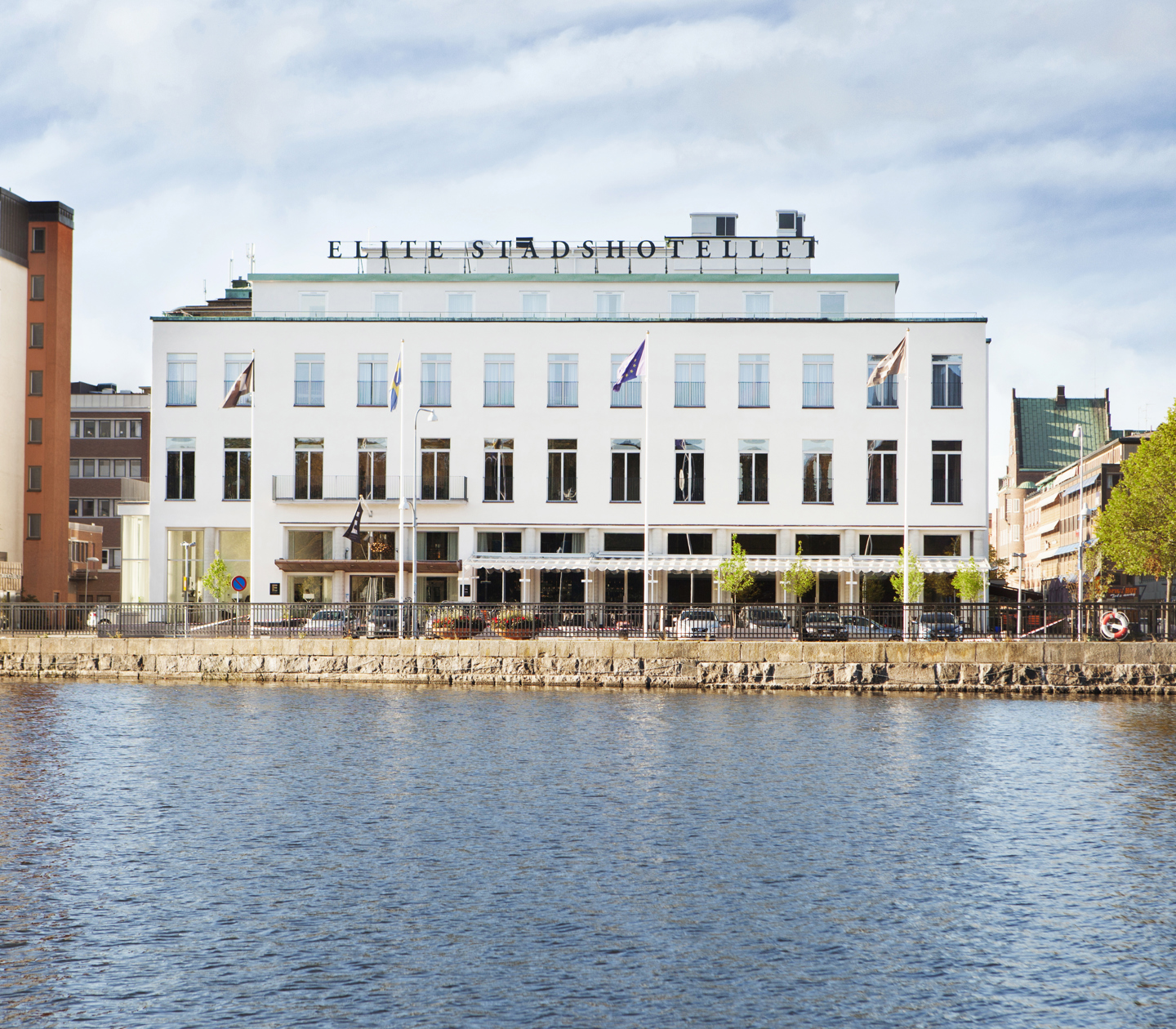 The grand facade of the Elite Stadshotellet with the Eskilstuna River in front