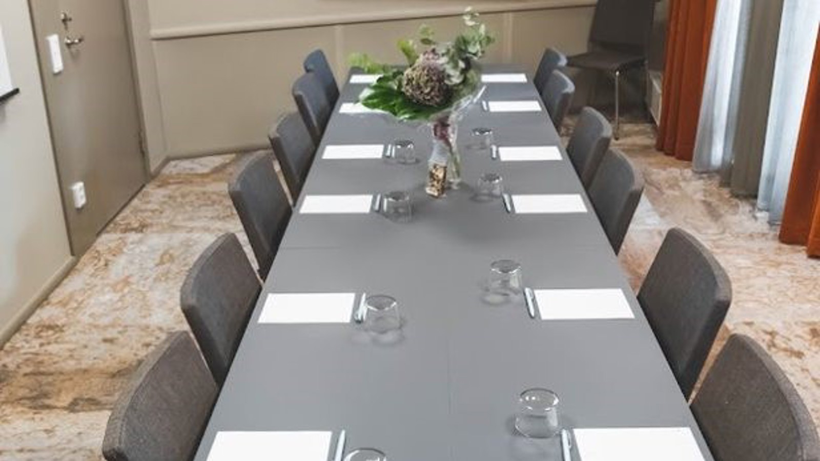 Gray conferens table with pad and pen