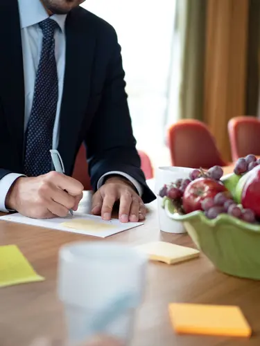 A person taking notes at a table