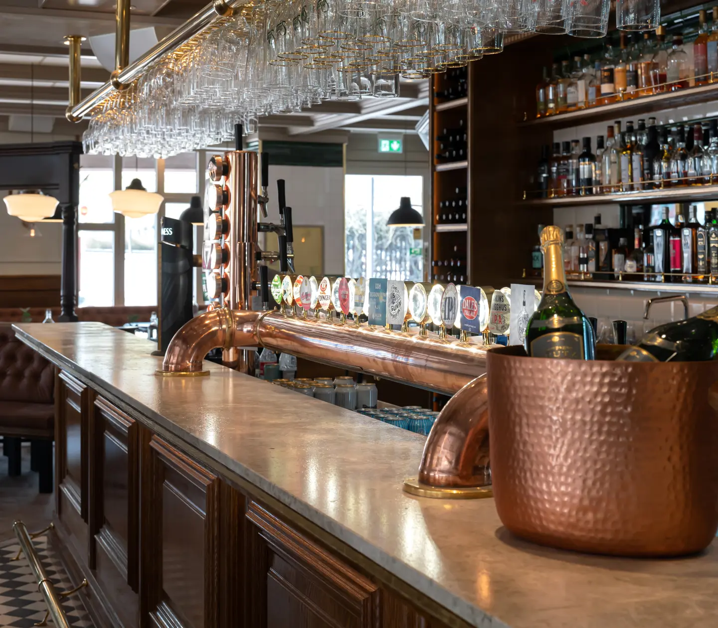 Bar counter with beer taps, bottles and glasses