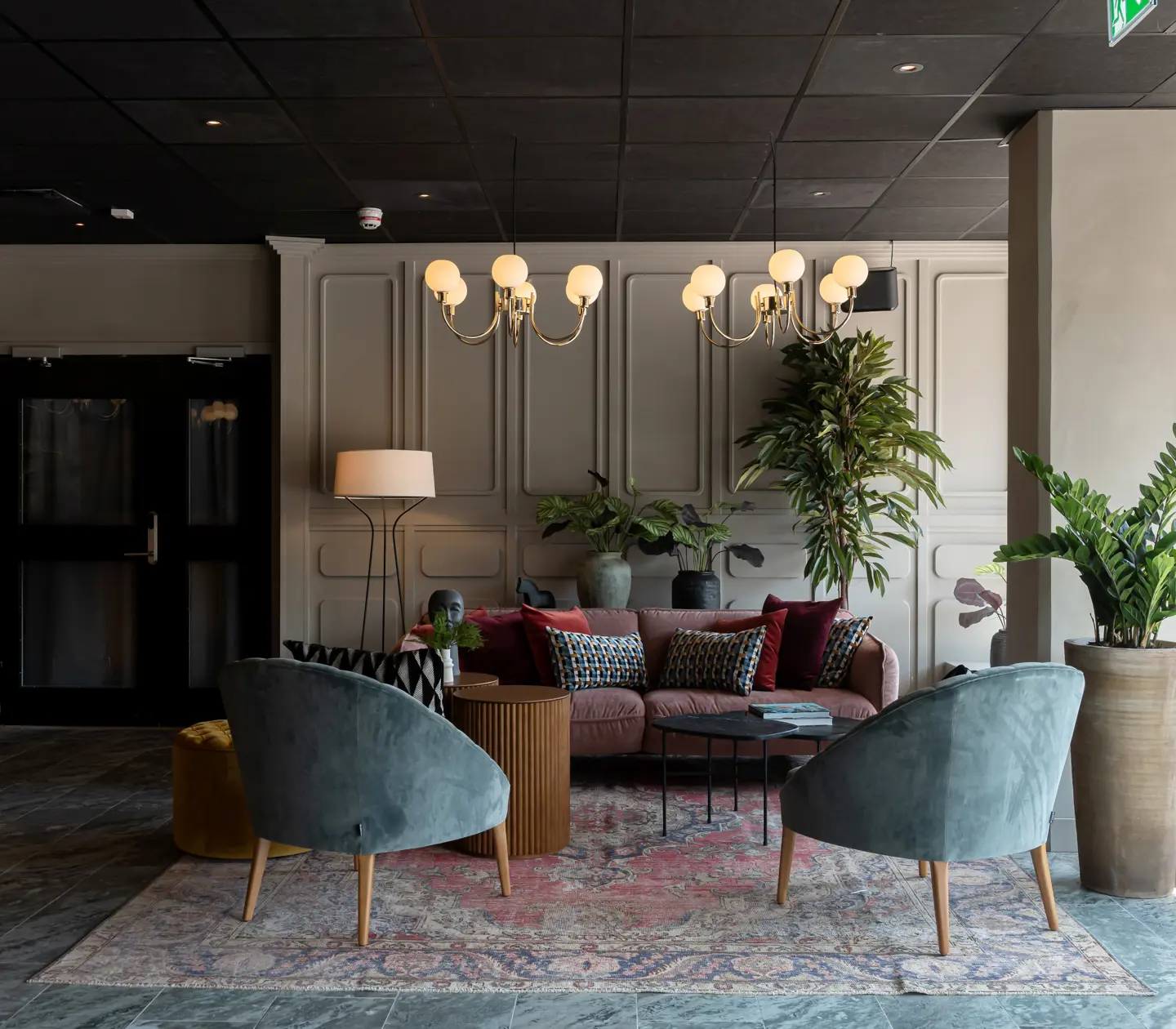 Hotel lobby with lounge furniture and plants