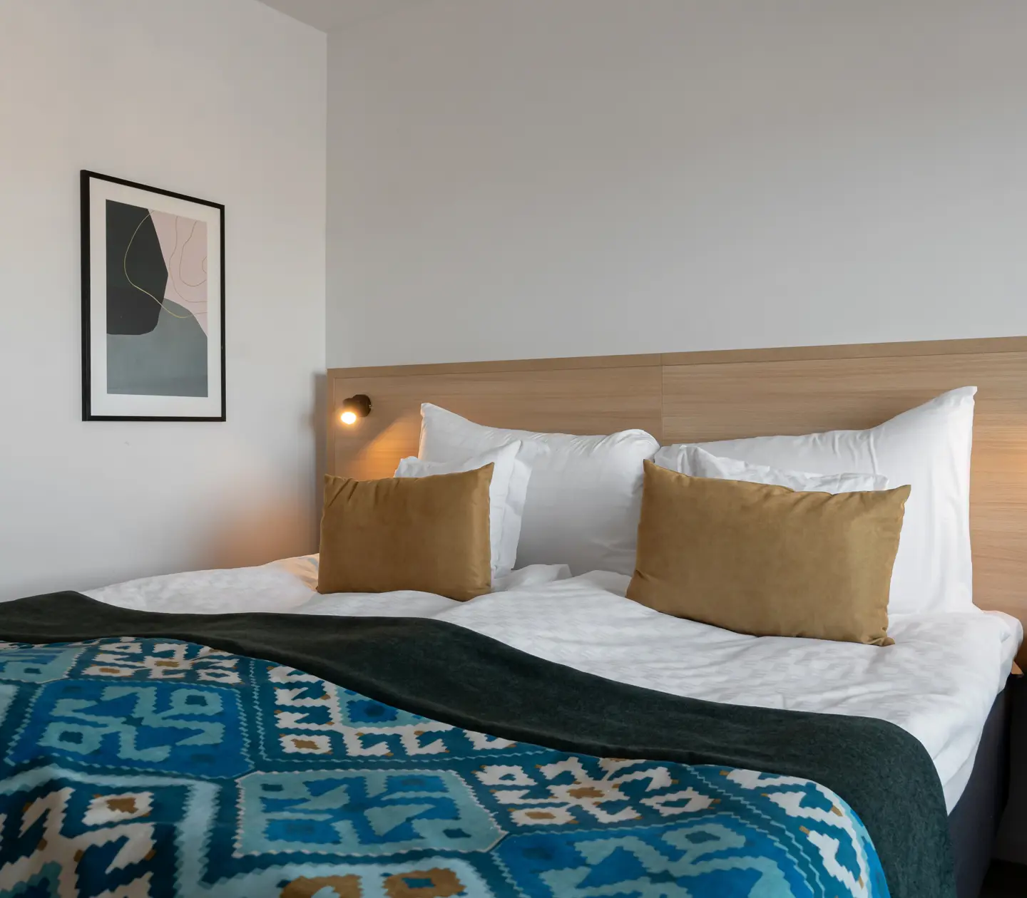 Double bed with wooden headboard
