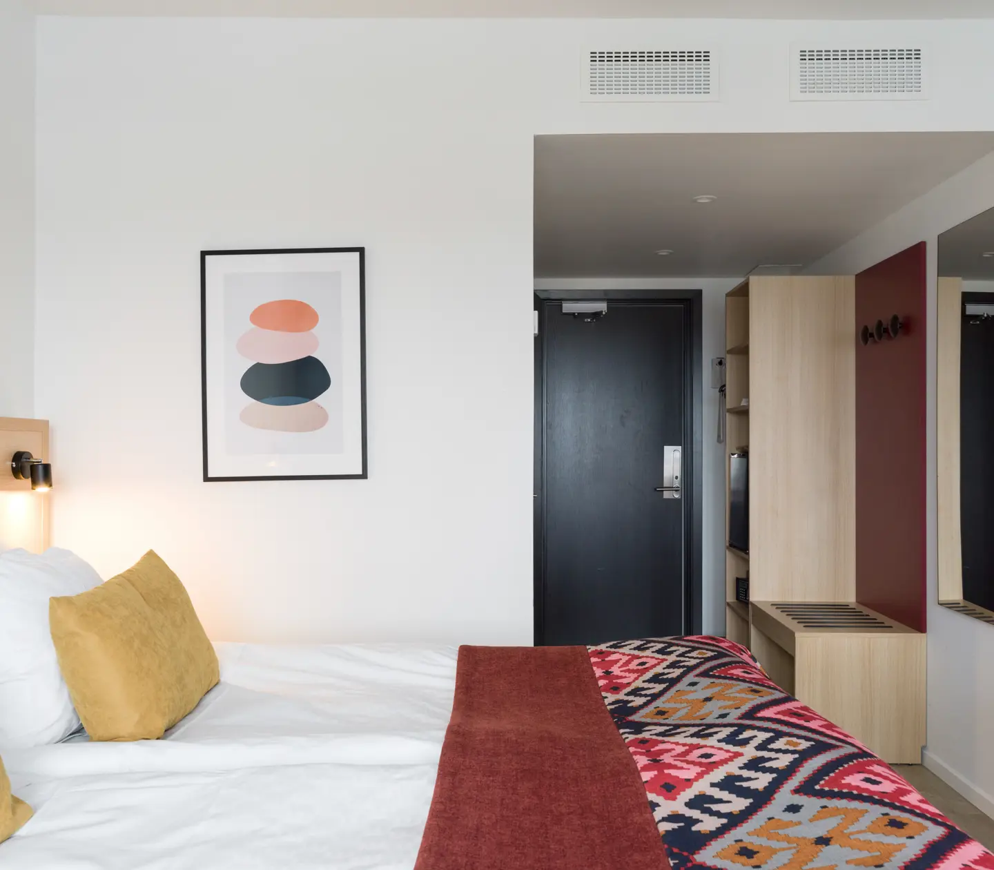 Hotel room with double bed and blackboard