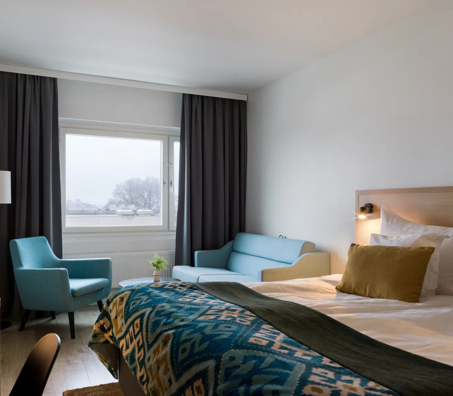 Hotel room with double bed and sofa bed