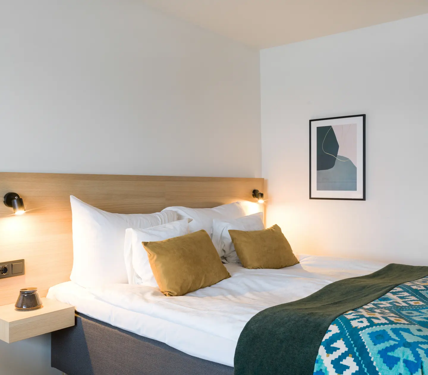 Hotel room with double bed and blackboard
