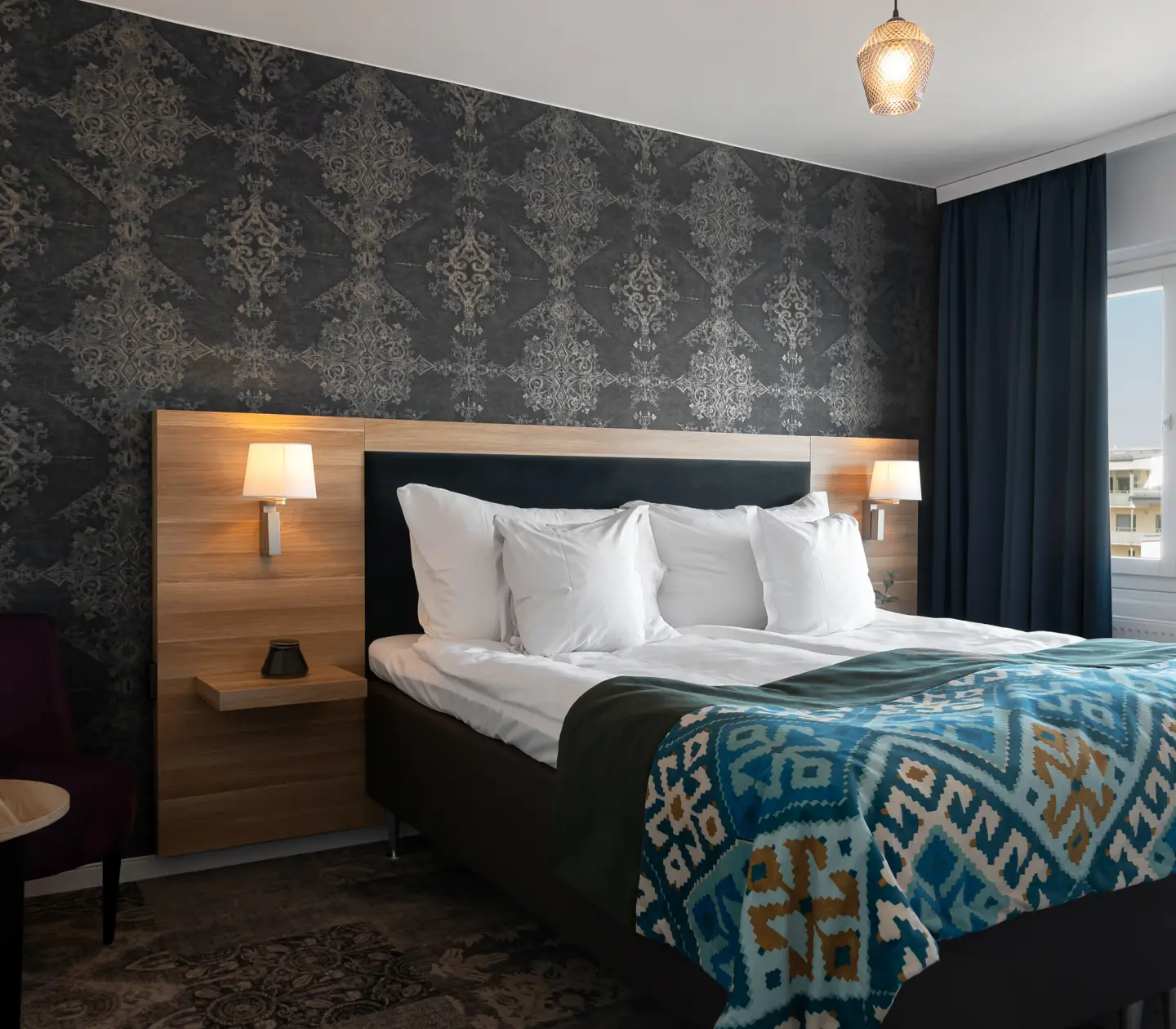 Suite with double bed and large window
