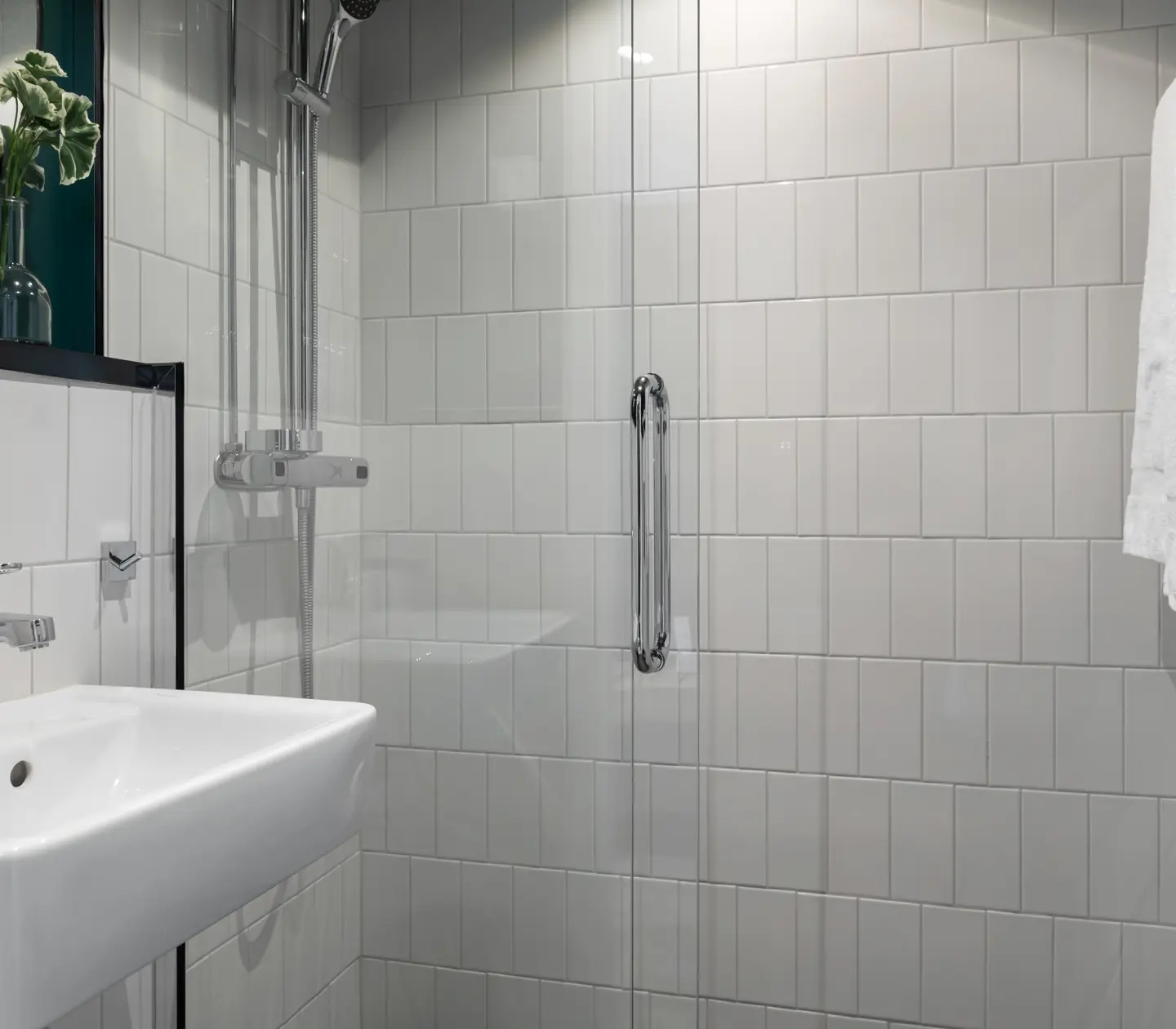 Bright bathroom with sink and shower