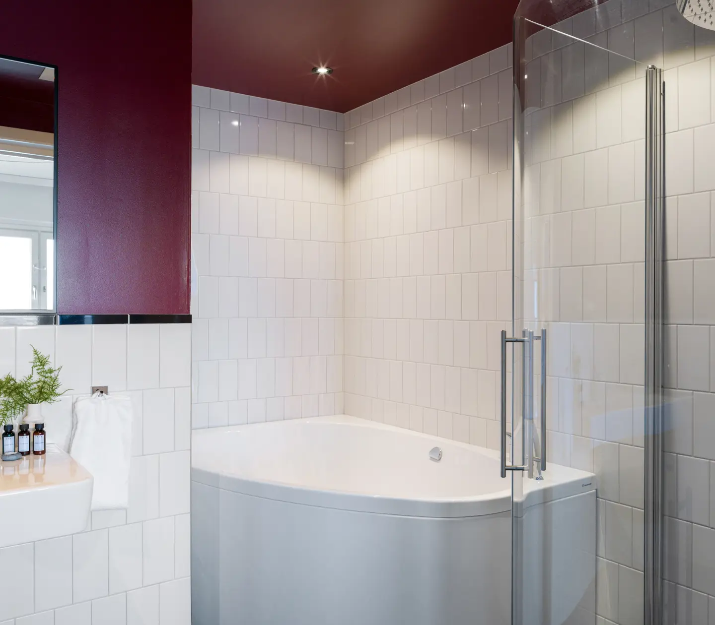 Red bathroom with shower and bathtub