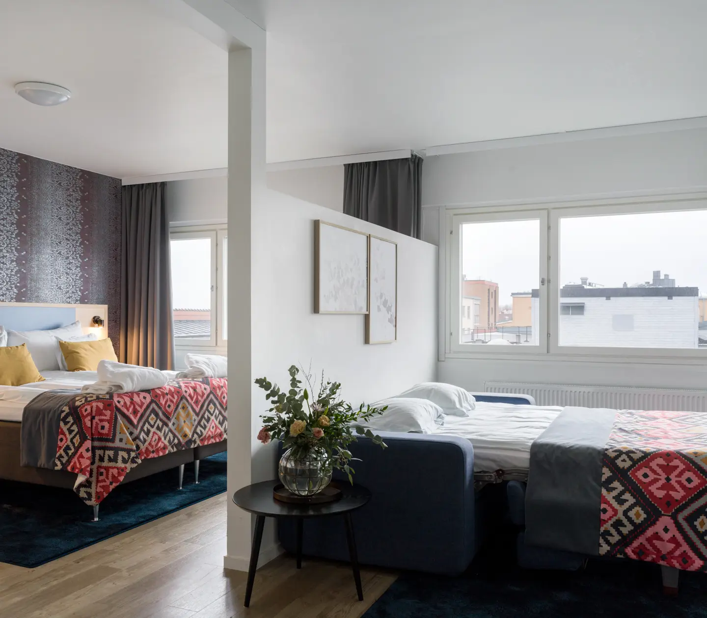 Hotel room with double bed and sofa bed