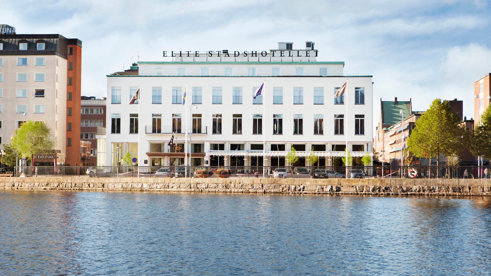 The grand facade of the Elite Stadshotellet with the Eskilstuna River in front