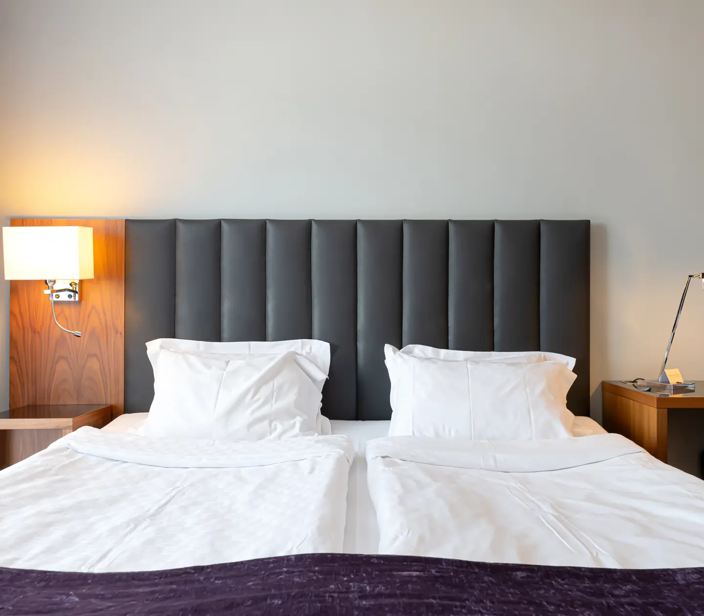 Hotel room with double bed and desk