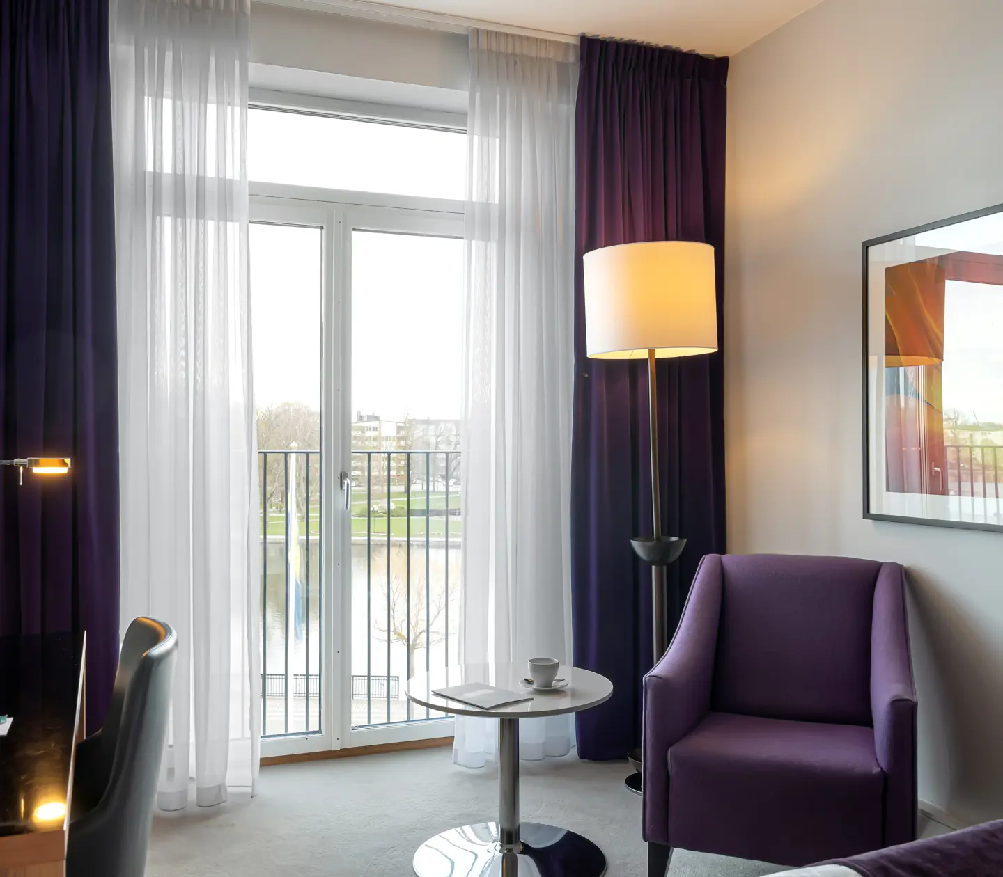 Hotel room with armchair and large window