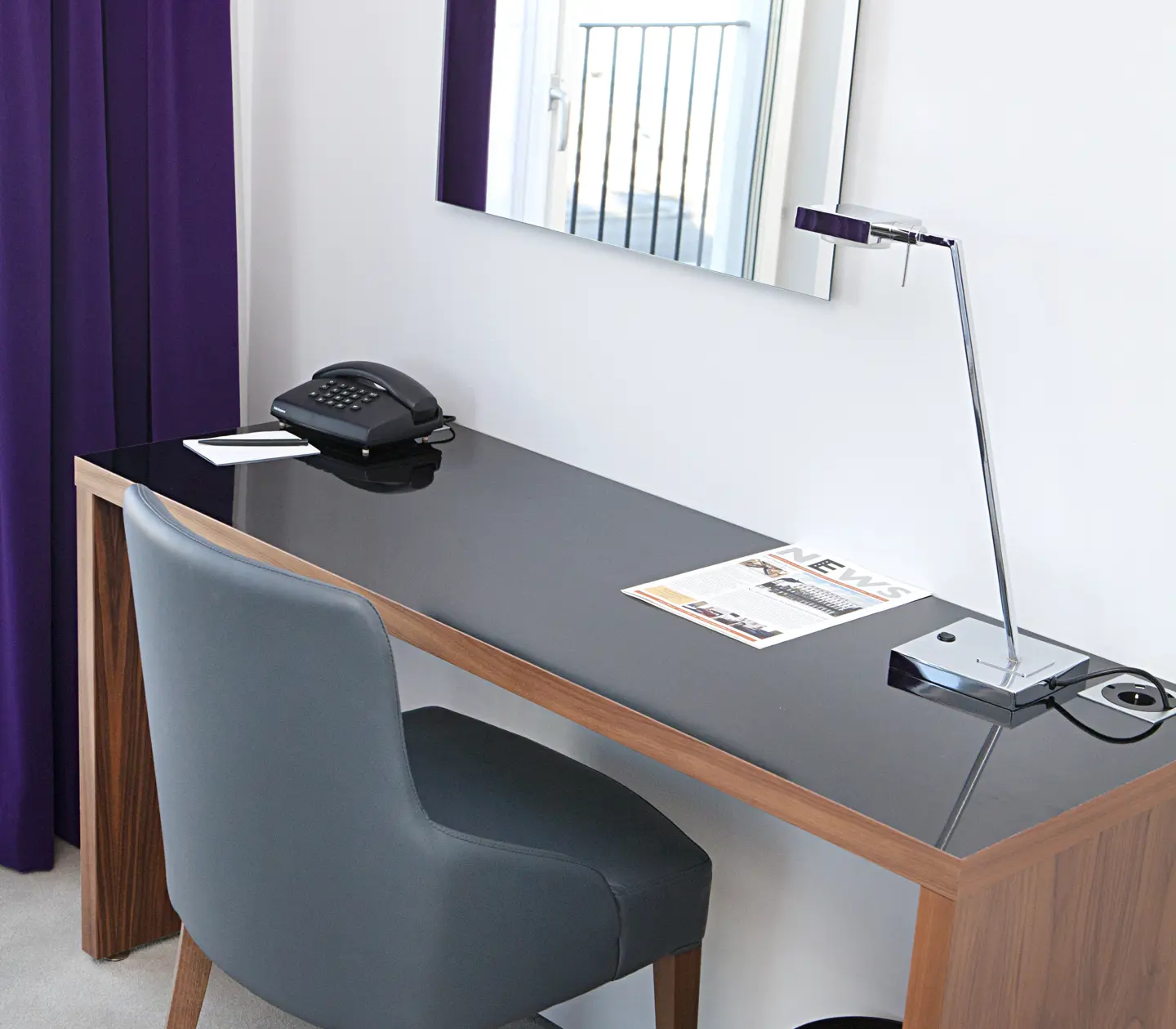 Desk with mirror and telephone