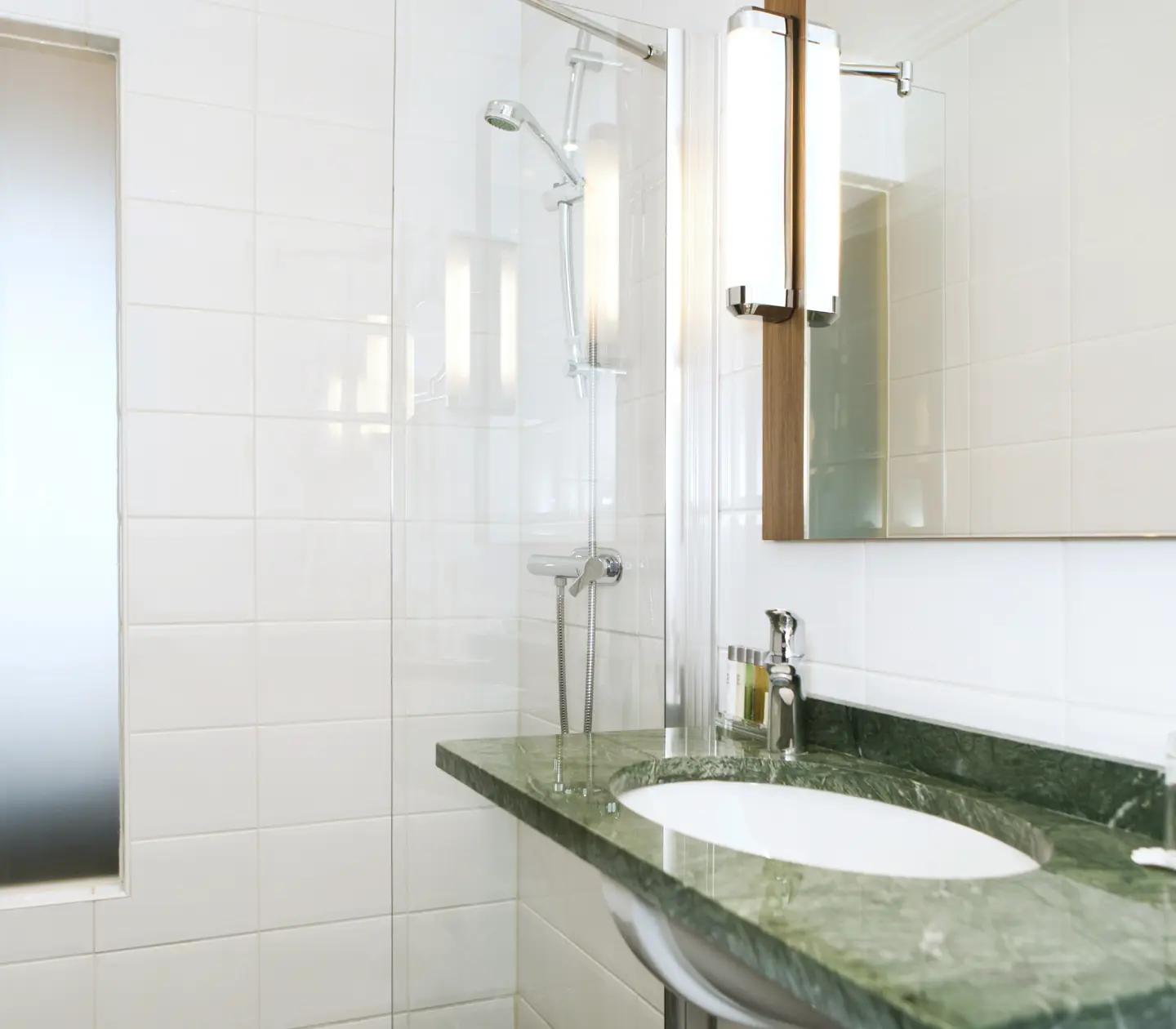 Bathroom with sink, shower and mirror