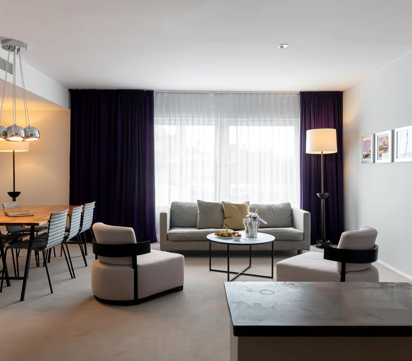 Suite with sofa, dining table and window