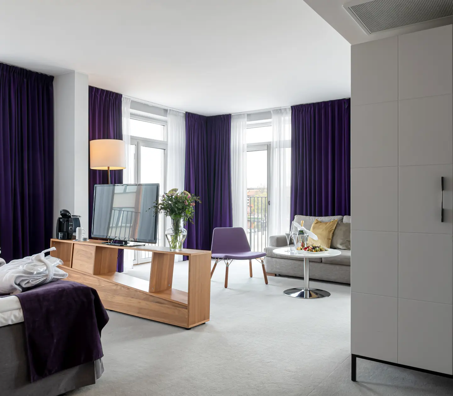 Suite with sofa, wardrobe and large windows