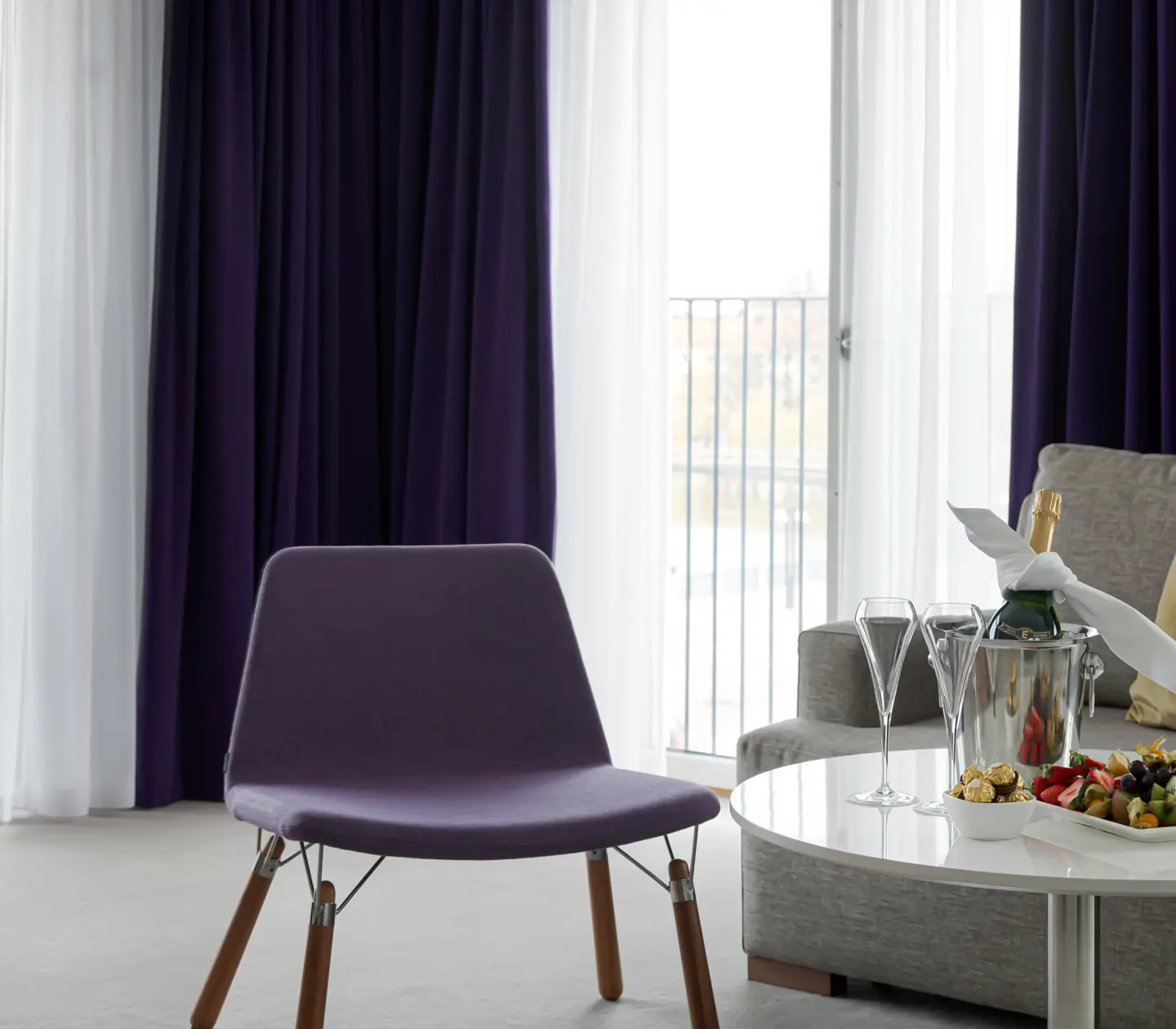 Suite with sofa, armchair and large windows