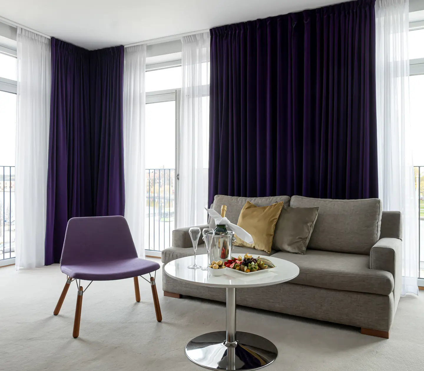 Suite with sofa, armchair and large windows