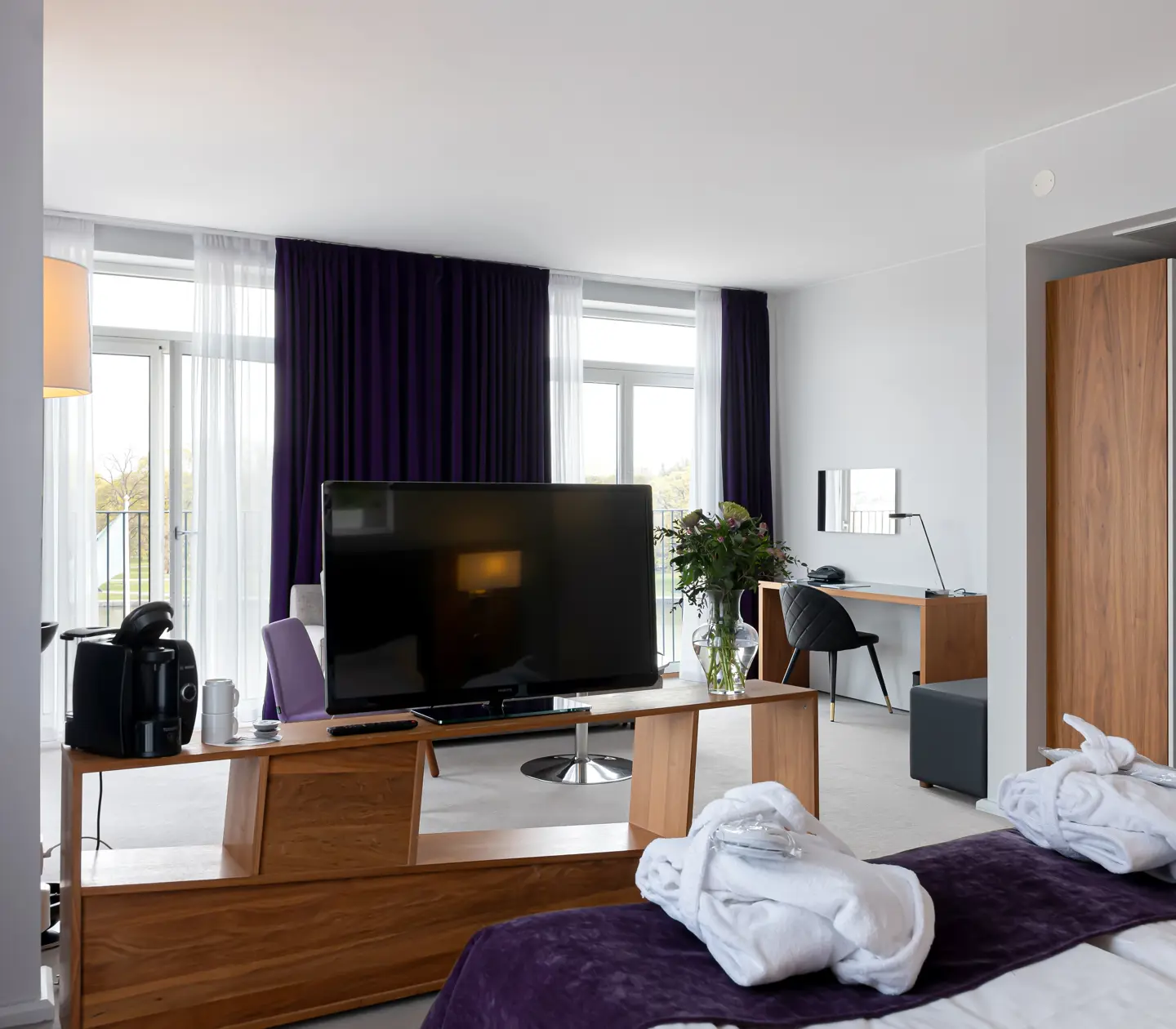 Suite with bathrobes, TV and large windows