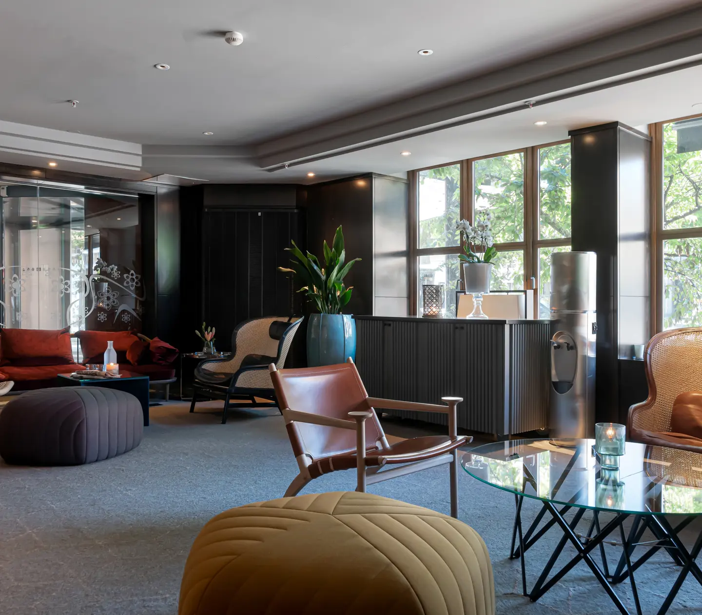 Hotel lobby with sofa groups and plants