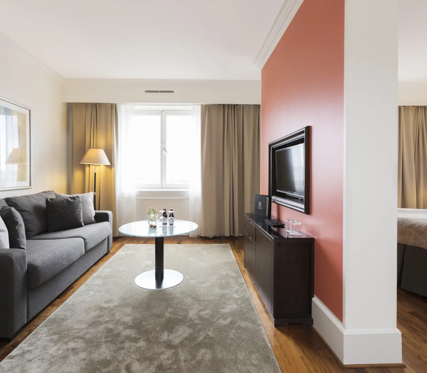 Suite with two rooms with bed, sofa and TV