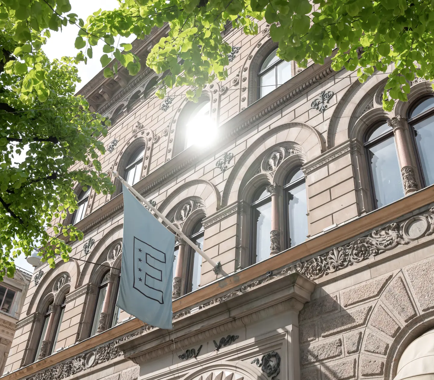 Facade of Elite Plaza Hotel with blue Elite flag