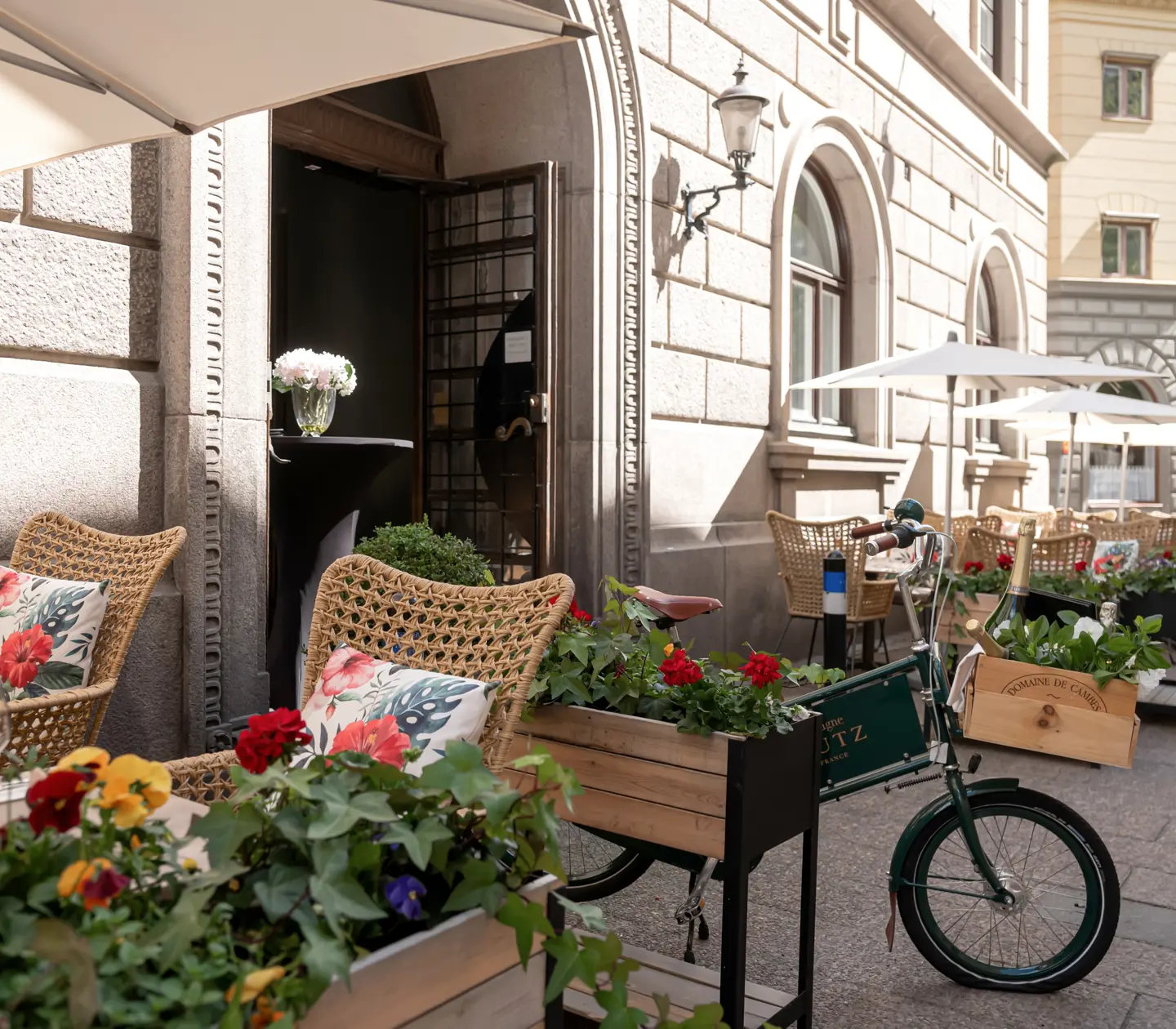Outdoor seating with flowers, parasols and seating areas