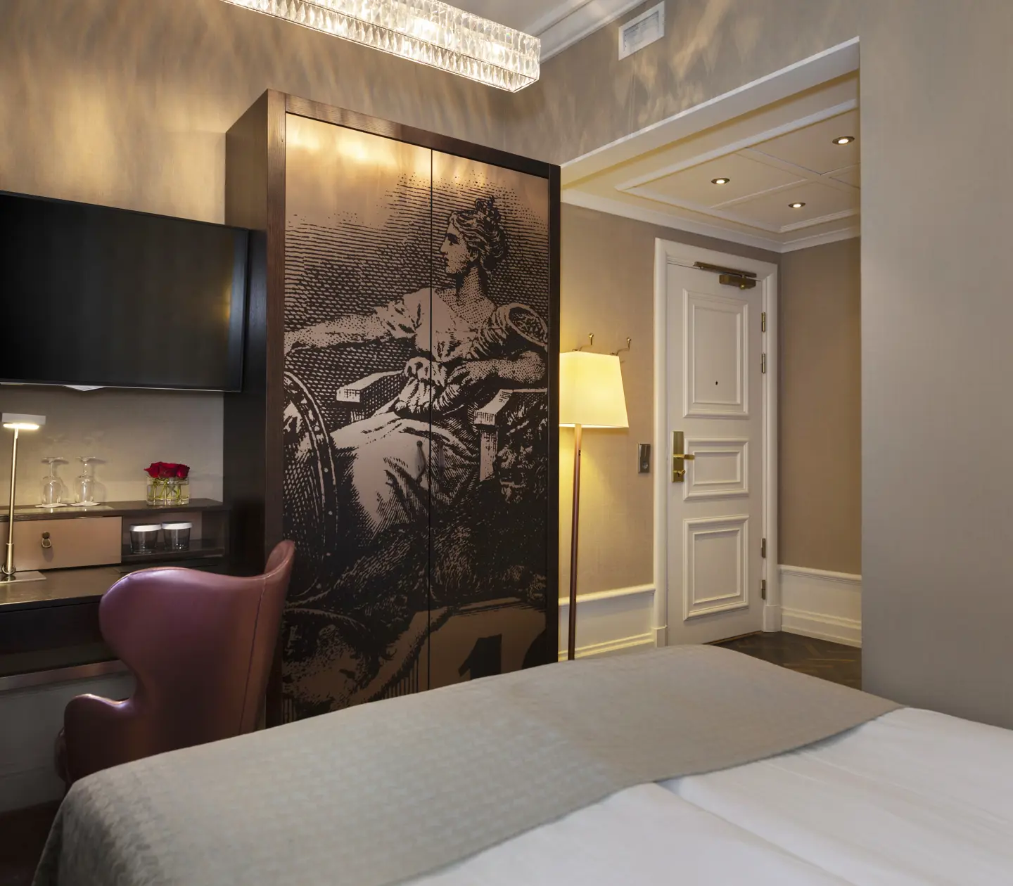Cozy hotel room with bed, TV and wardrobe