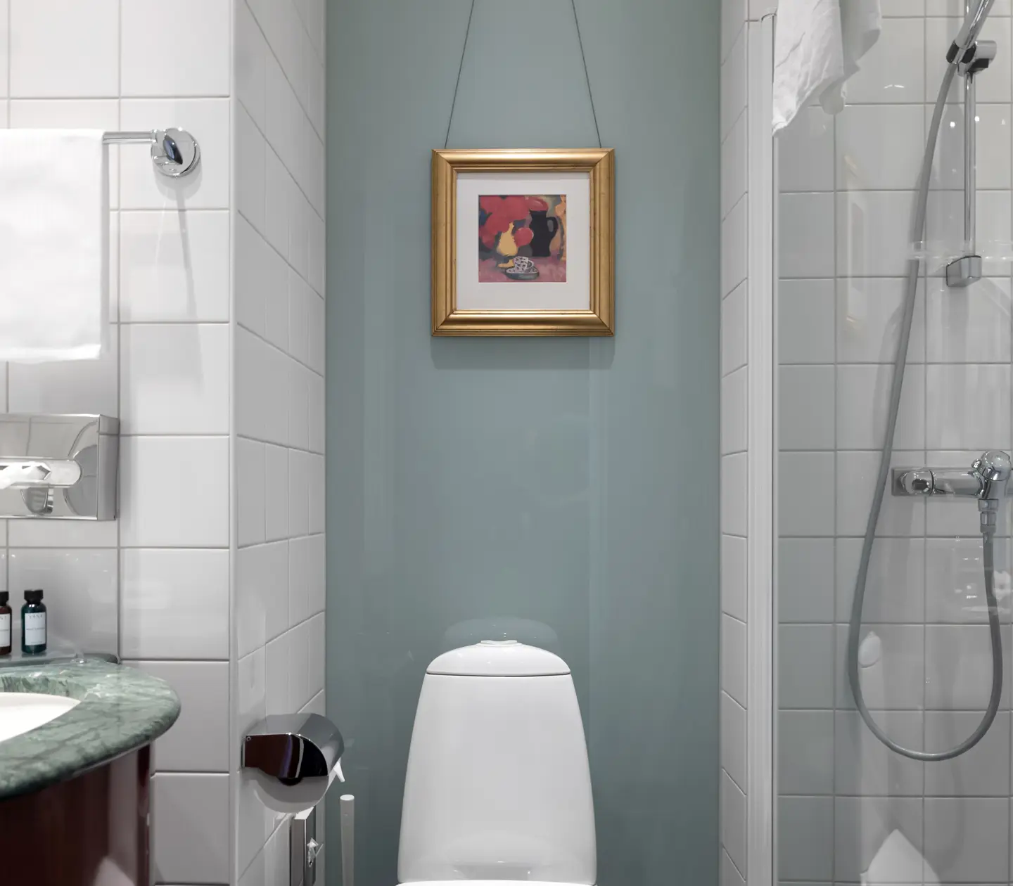 Bright bathroom with shower, toilet and sink