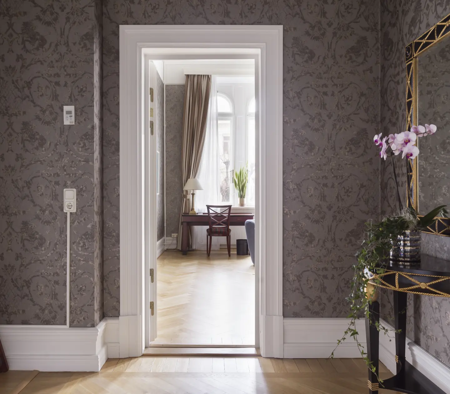 Suite with gray walls and mirror.