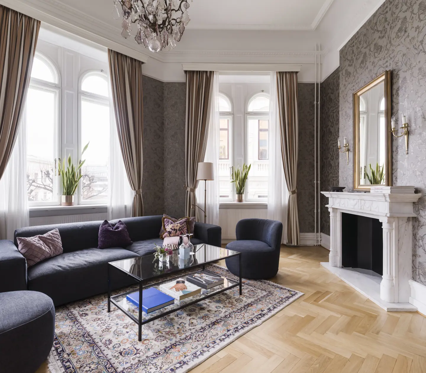 Suite with fireplace, windows, and seating area