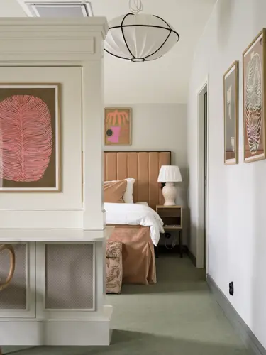 Room with wall in front of bed
