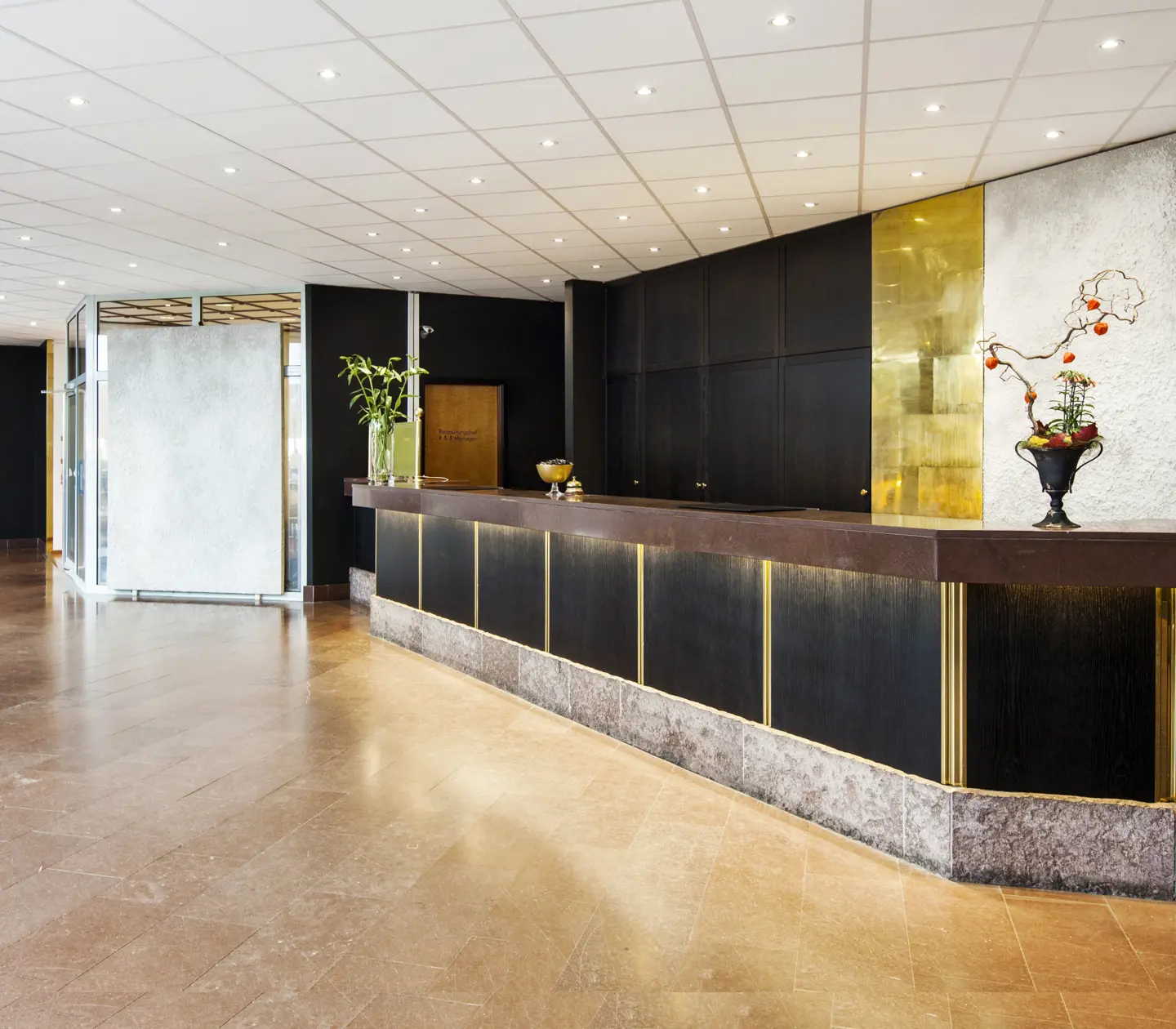 Long reception desk in hotel lobby