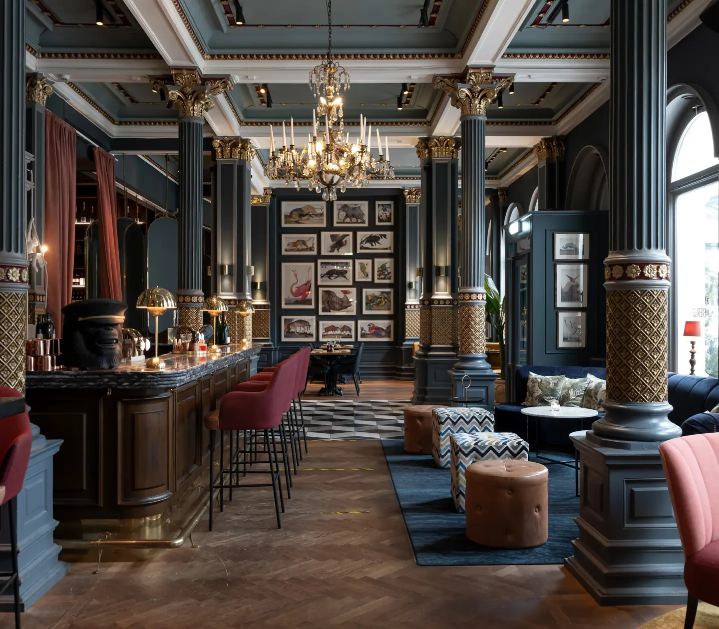 Cozy hotel environment with seating, bar counter and paintings