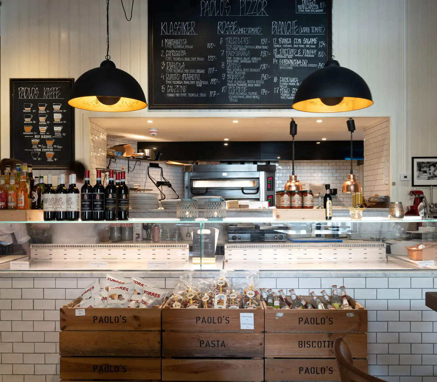 Bright restaurant environment with menus, coolers and bottles