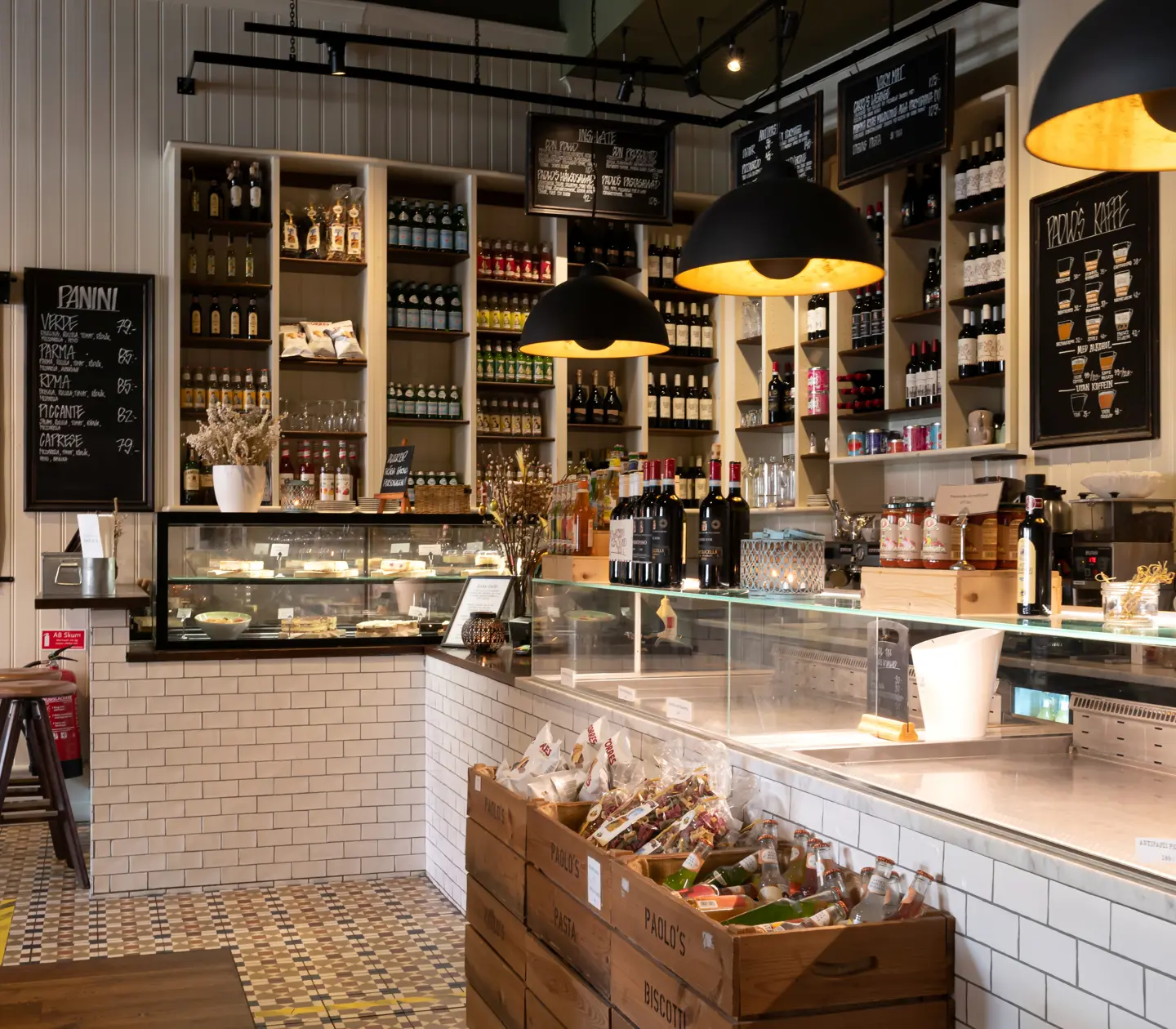 Bright restaurant environment with menus, coolers and bottles