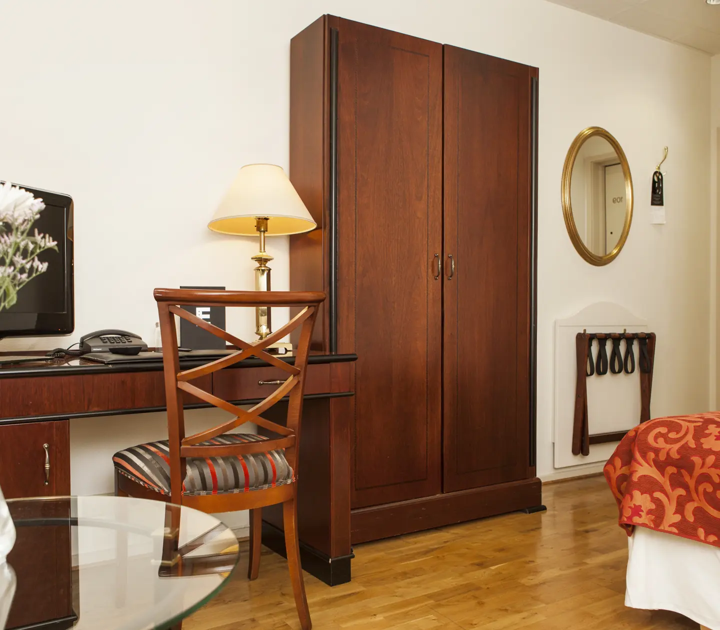 Hotel room with desk and wardrobe