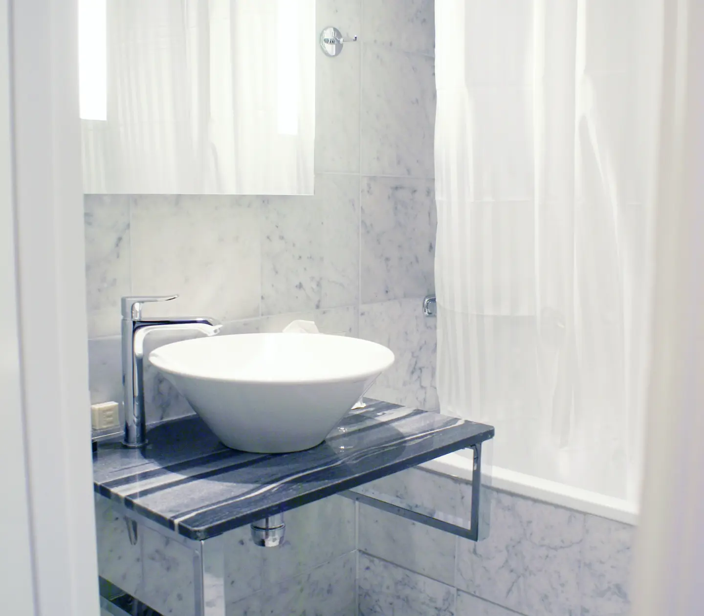 Bright bathroom with sink and mirror