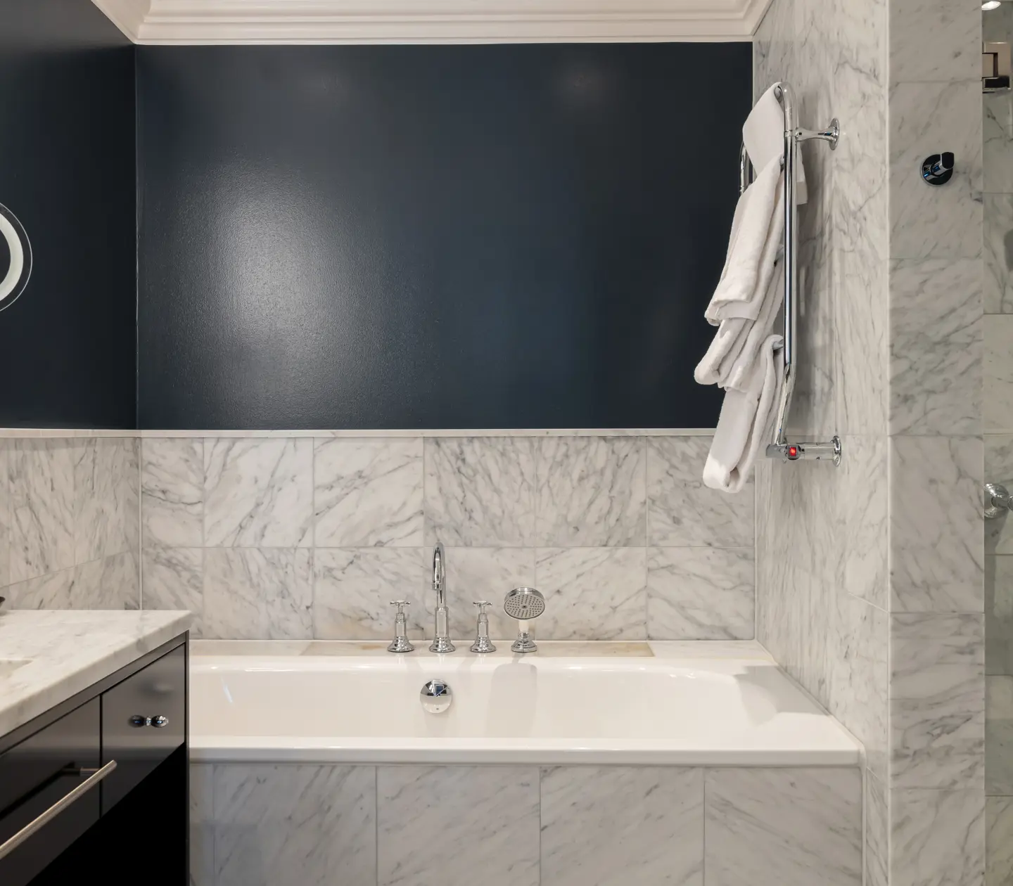 Bright bathroom with sink, shower and bathtub