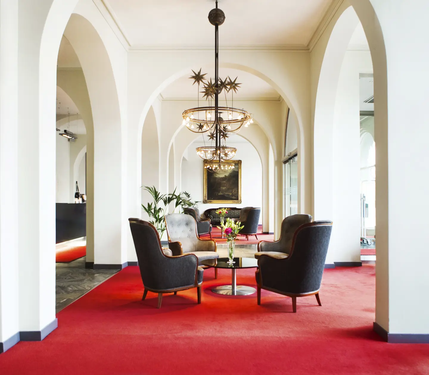 Hotel lobby with red carpet and lounge furniture