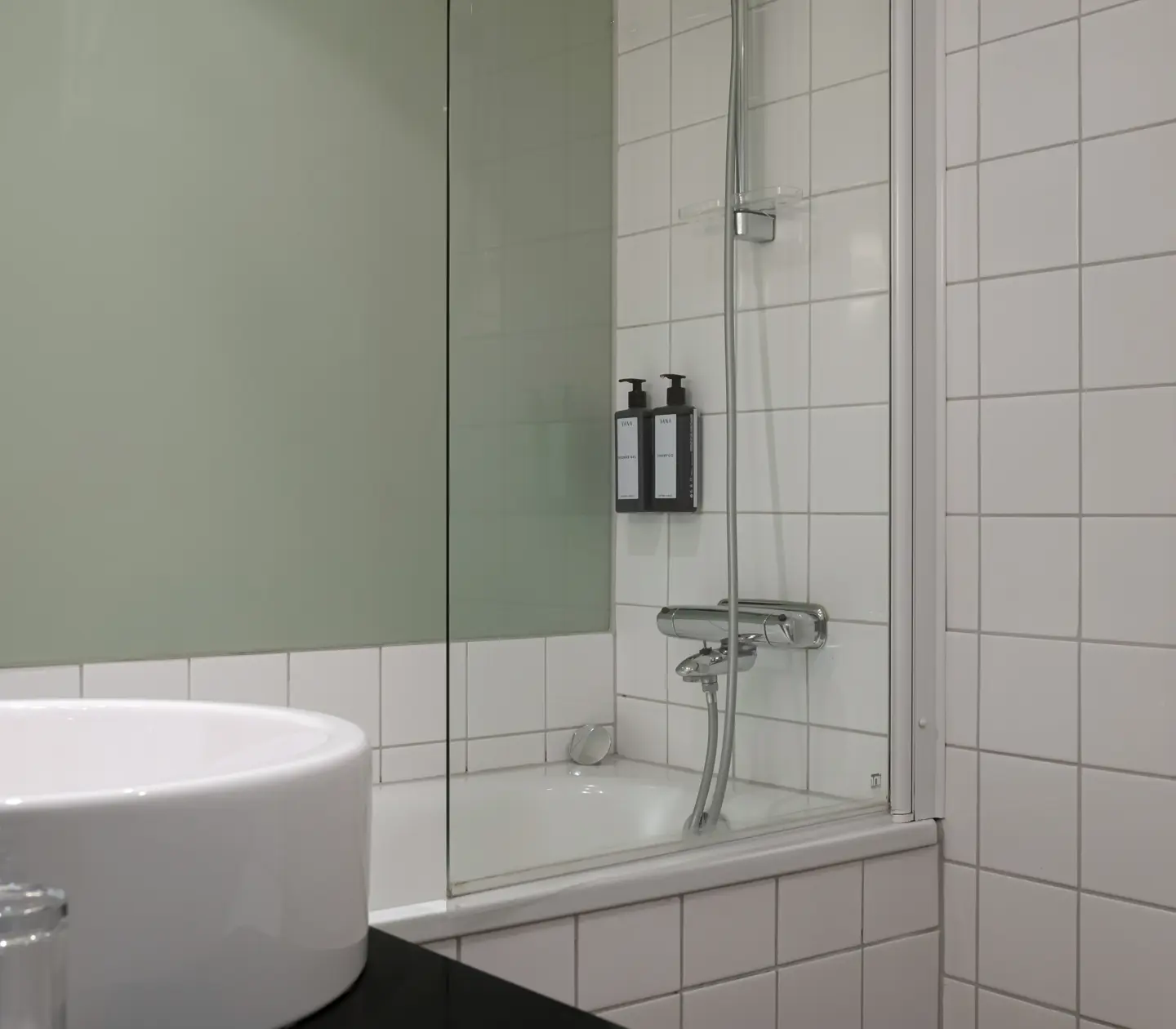 Bright bathroom with sink and bathtub