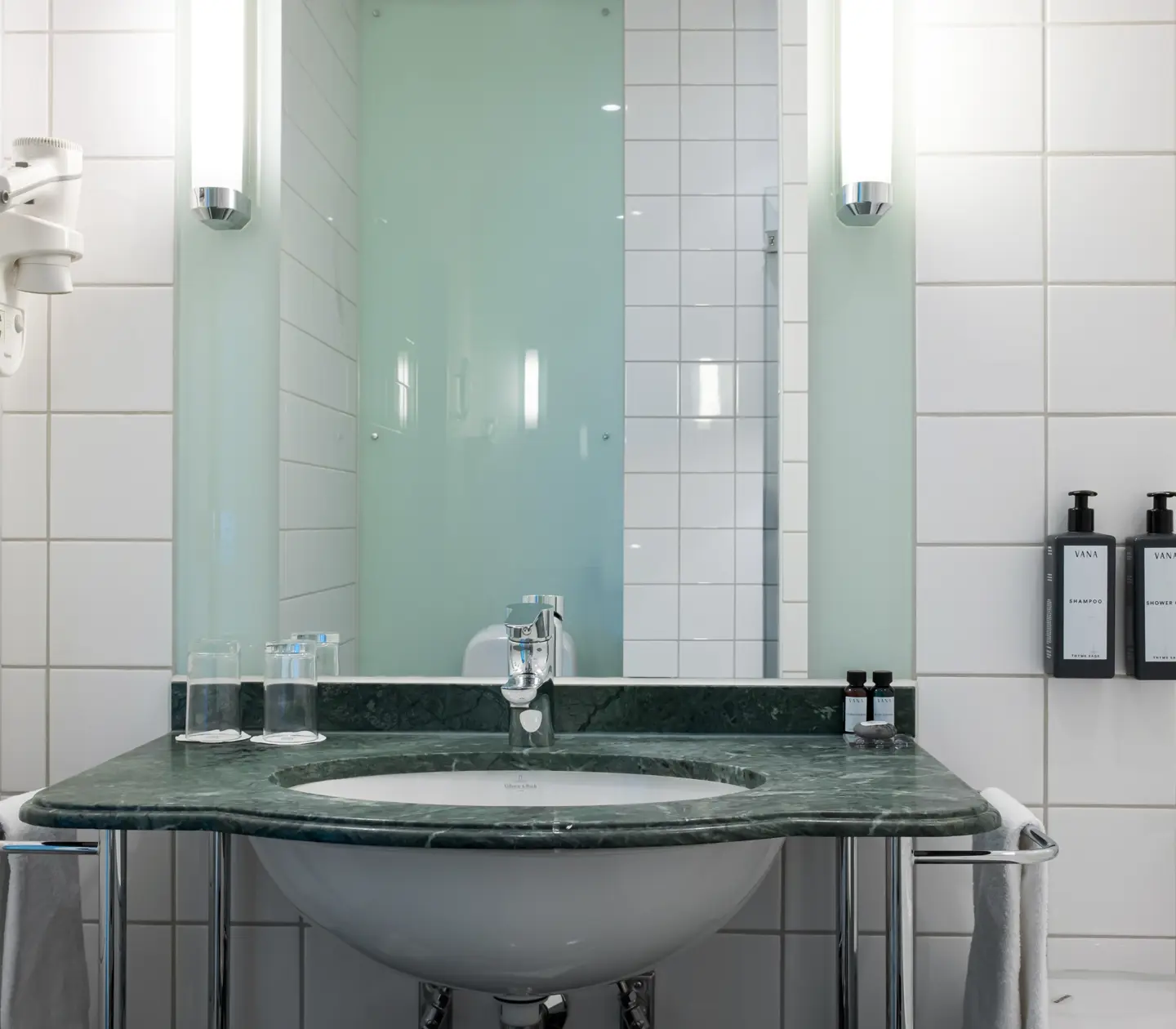 Bright bathroom with sink and mirror