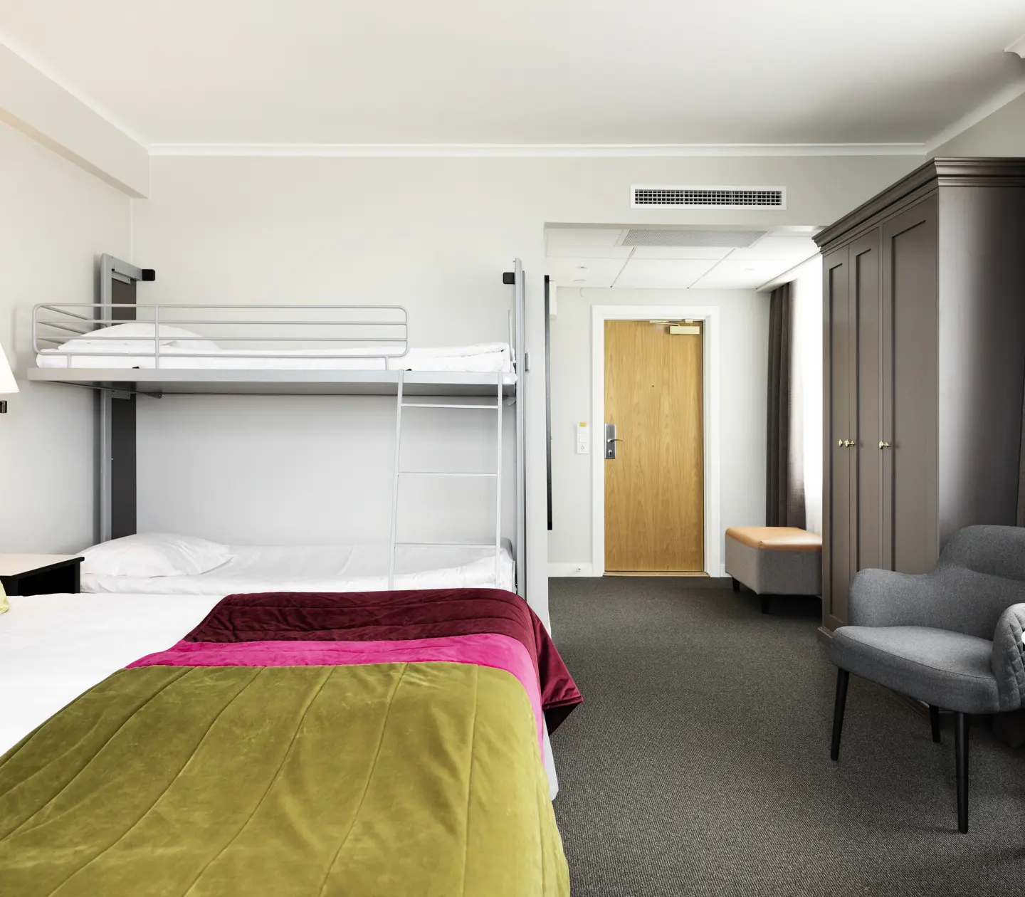 Hotel room with bed, bunk bed and wardrobe