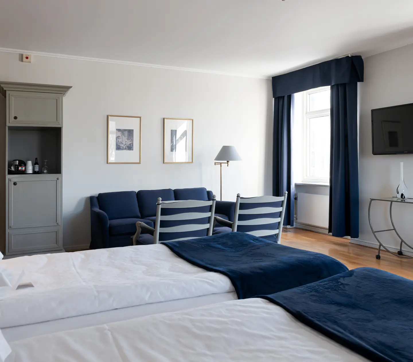 Hotel room with bed, sitting area and window
