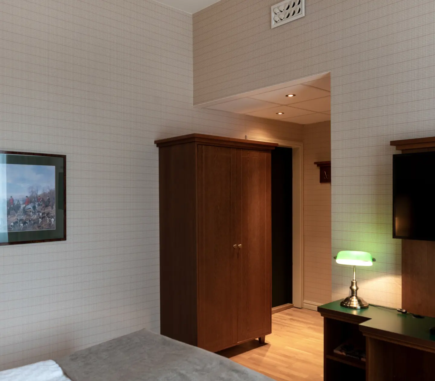 Hotel room with wardrobe, blackboard and TV