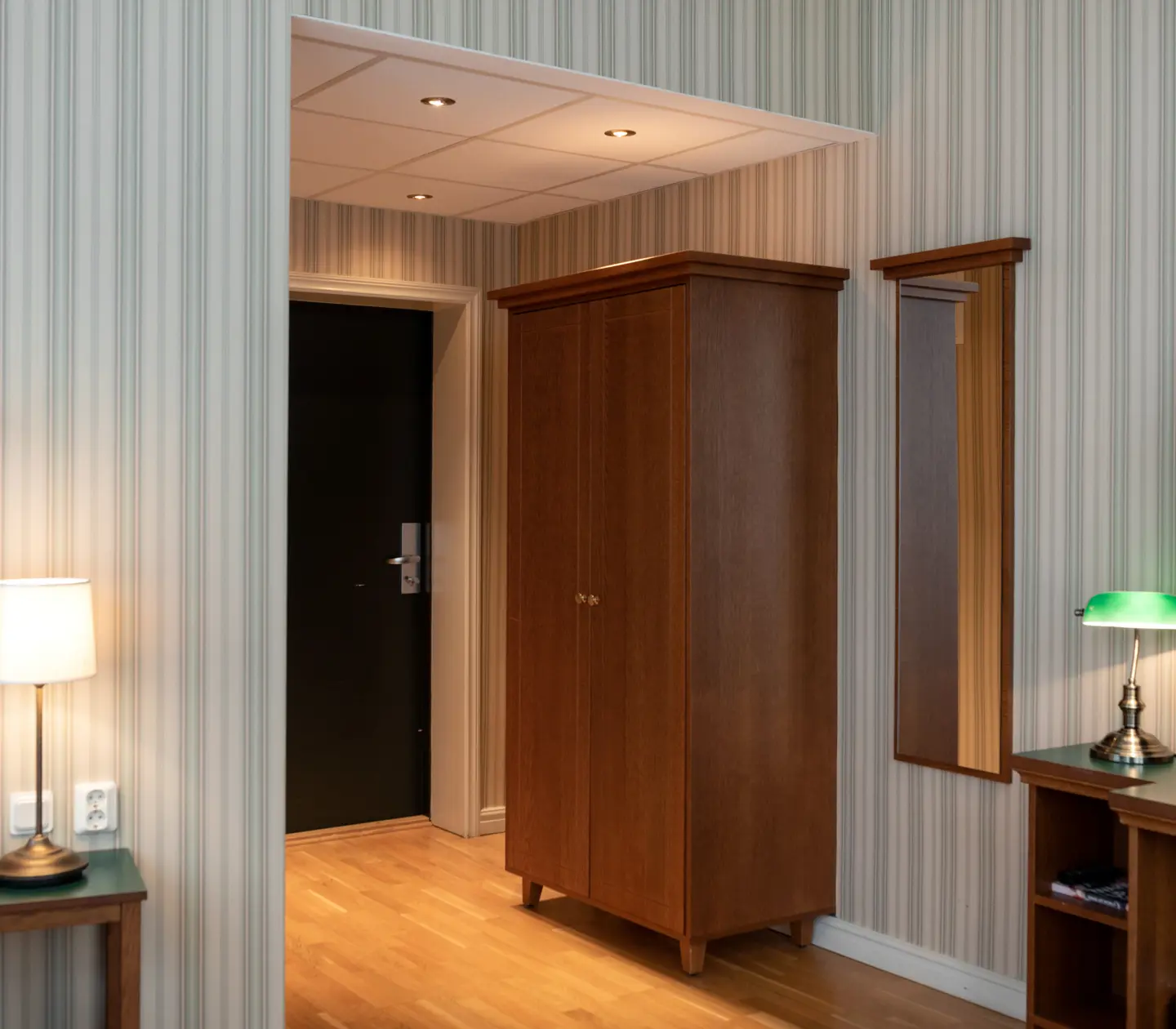 Hotel room with wardrobe, mirror and TV