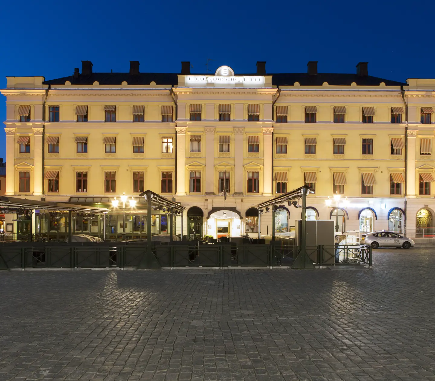 The grand facade of the Elite Stora Hotellet at dusk