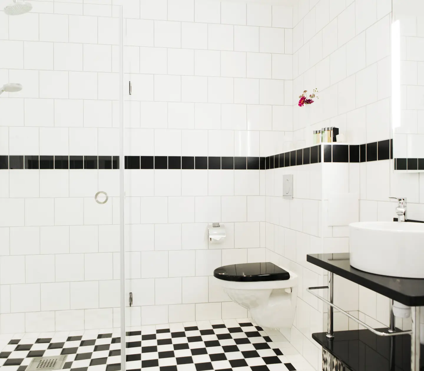 Bright bathroom with sink, toilet and shower