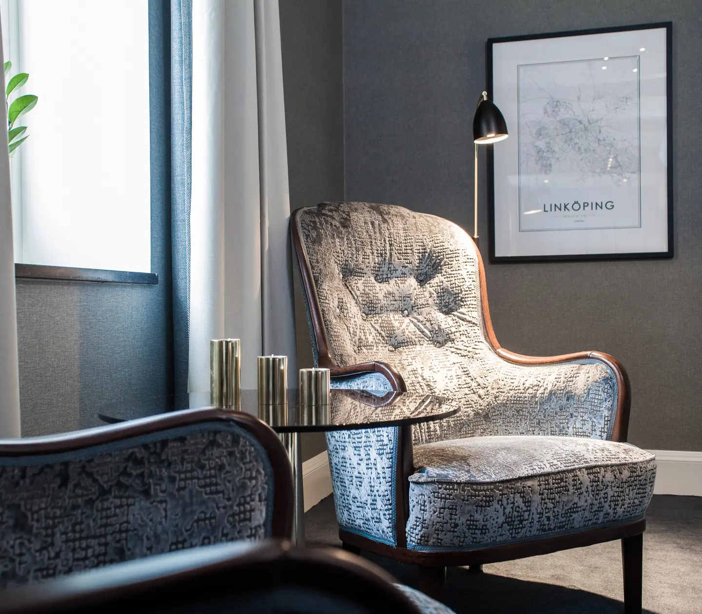 Bright suite with armchairs, floor lamp and window