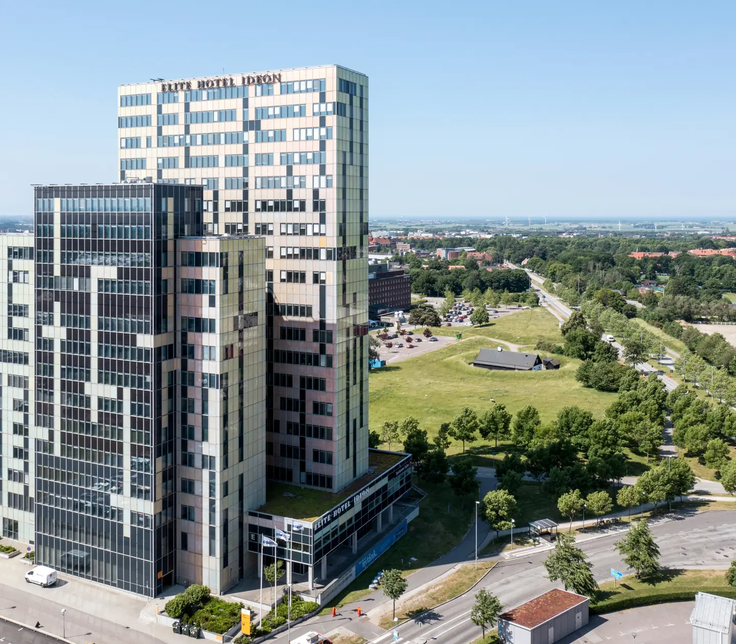 The facade of the Elite Hotel ideon with Lund in the background